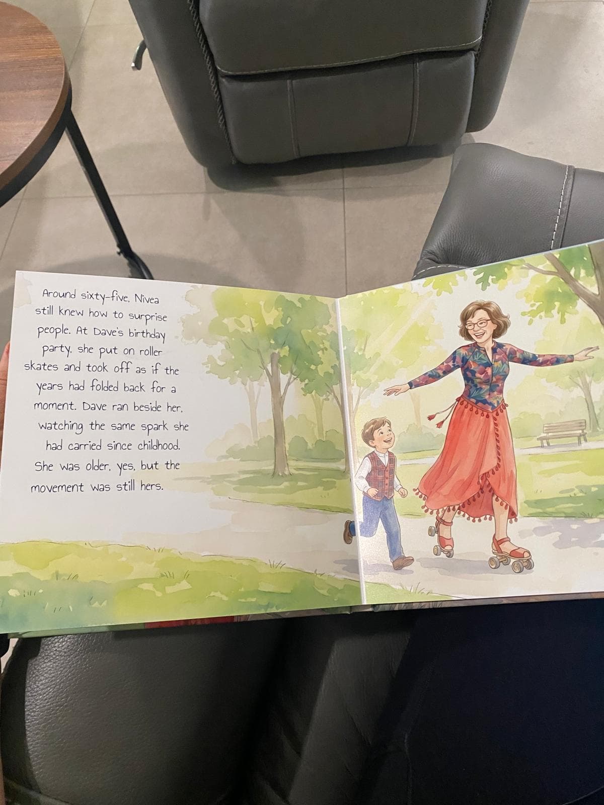 A photograph of an open Nivea book spread showing her roller-skating beside a child, with the printed story text and center binding visible